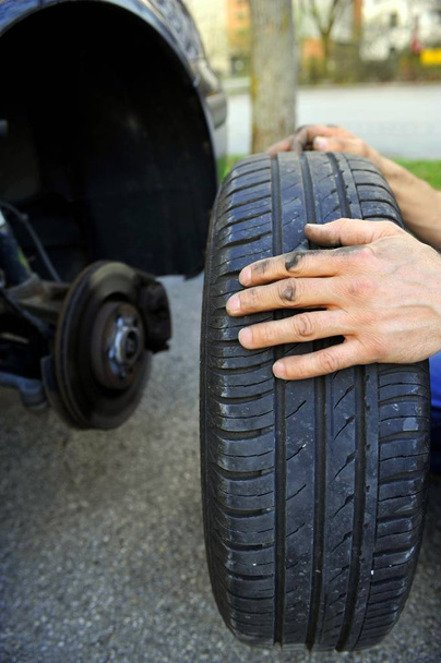 close up of a tire in the garage - Φωτογραφία, εικόνα