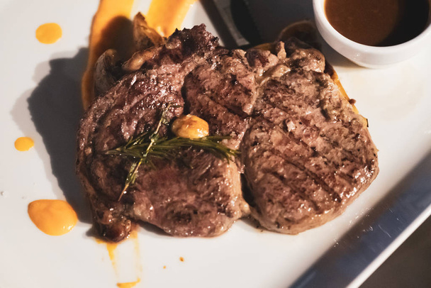 Grilled marbled meat steak - 写真・画像