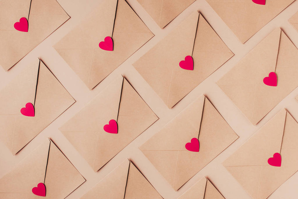 Valentines day background. Envelops with red hearts decor - 写真・画像