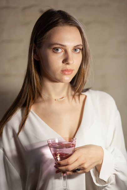 Portrait of beautiful fair young woman with jewelry, one light source - 写真・画像