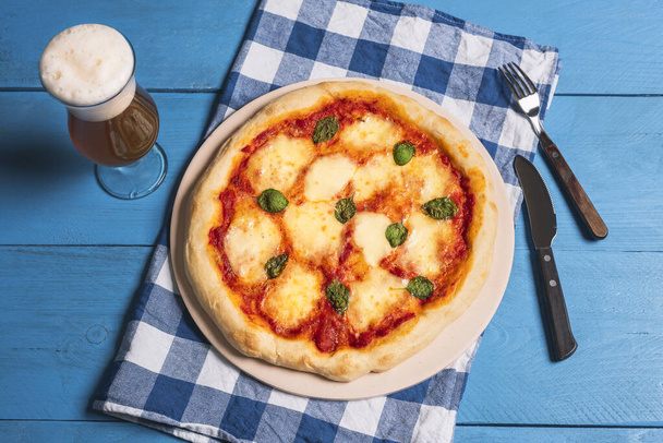 Pizza Margherita and beer. Cheese pizza. Mozzarella pizza. - Photo, Image