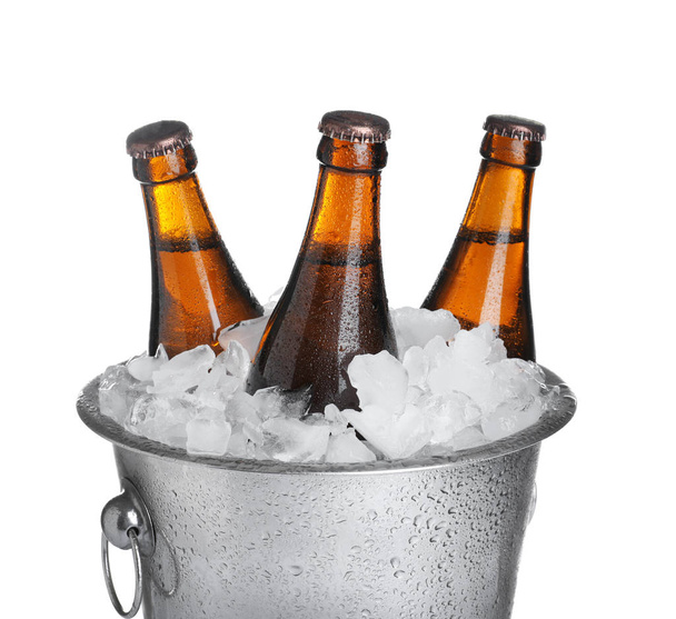 Beer in metal bucket with ice isolated on white - Фото, зображення