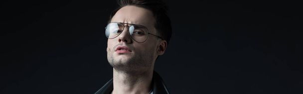serious stylish brutal man in eyeglasses isolated on black, panoramic shot - Fotoğraf, Görsel