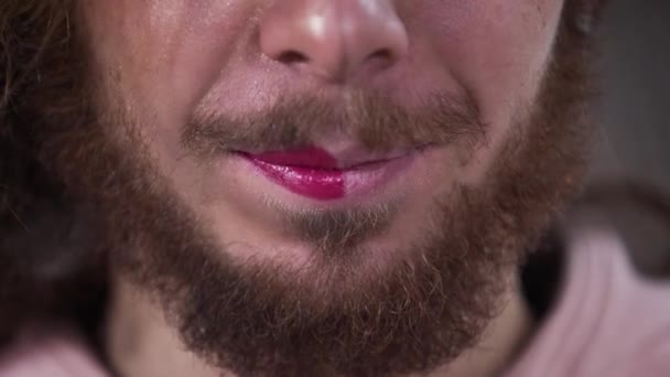 Close-up of lower part of Caucasian intersex persons face with one side with makeup and other clear one. Two parts of binary gender people. - Záběry, video