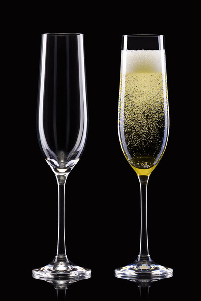 Set of empty and full champagne glasses isolated on black background. - Photo, Image
