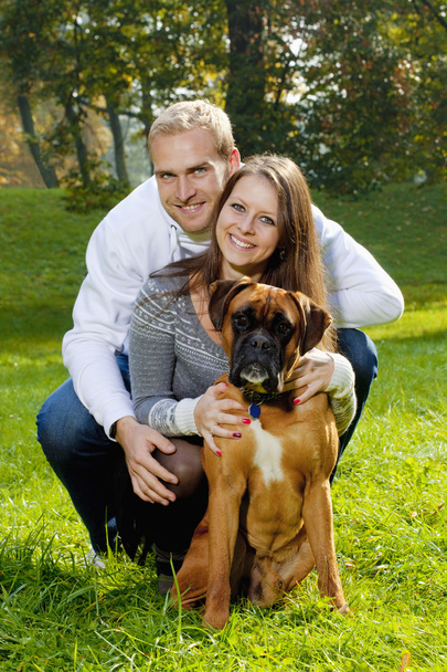 happy young couple with dog - Φωτογραφία, εικόνα