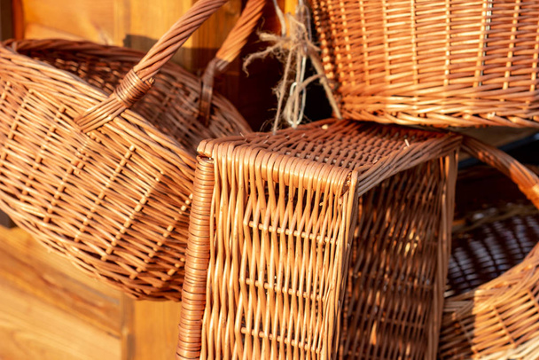 Many yellow wicker straw baskets in the street piled up. - Photo, Image