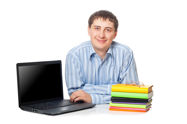 Young adullt man sitting with laptop - Фото, изображение