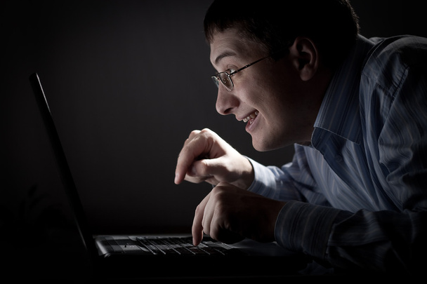 Crazy young adult man with laptop - Φωτογραφία, εικόνα