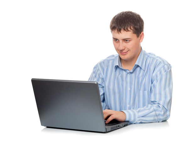 Young adult businessman working with laptop - Φωτογραφία, εικόνα