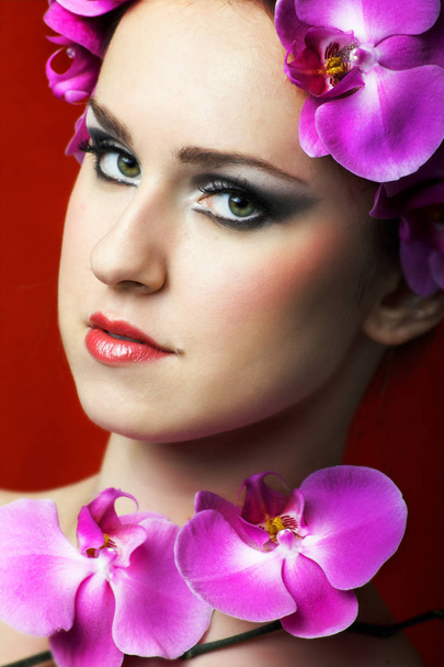 closeup view of woman with orchids - Φωτογραφία, εικόνα