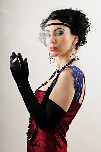 portrait of a beautiful young woman in a black dress - Fotó, kép