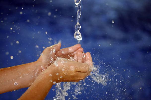 woman washing hands in water - Фото, зображення