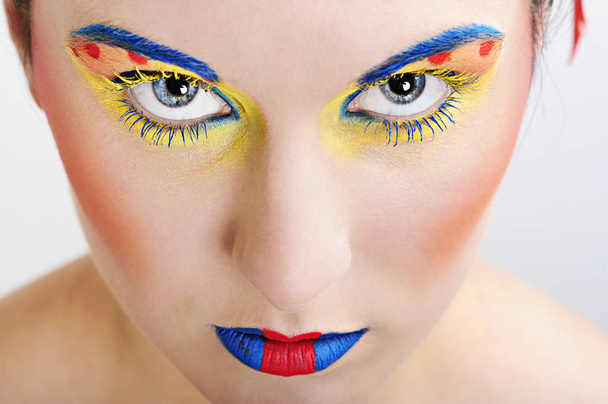 close-up portrait of a beautiful woman with creative makeup and blue eyes - Foto, Bild