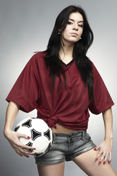Brunette girl with a soccer ball - Photo, image