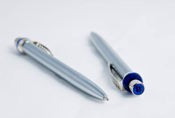 pen and ballpoint pens on white background - 写真・画像