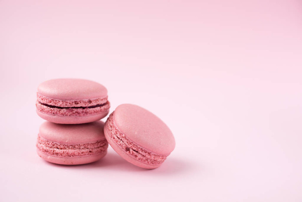 Pink macarons on pink background - Fotoğraf, Görsel