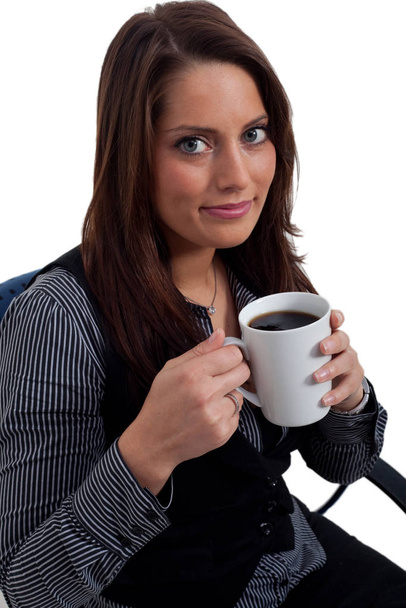 Young woman holding a cup of coffee - Photo, image