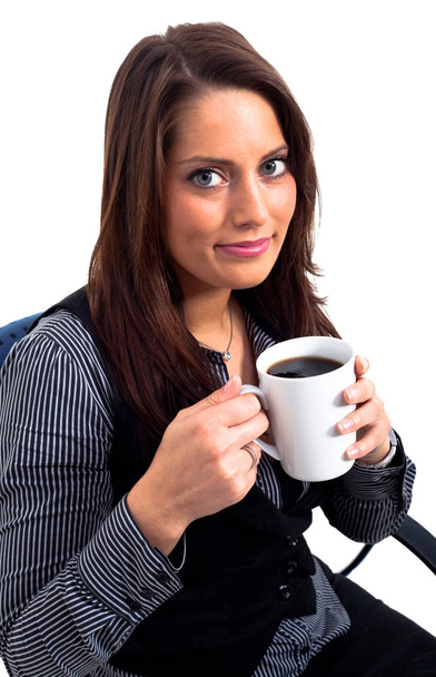 Young woman holding a cup of coffee - Фото, зображення