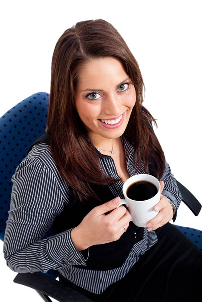 Young woman holding a cup of coffee - Foto, Bild