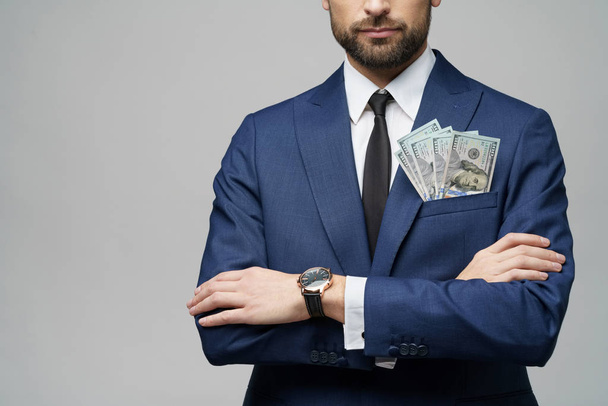 young handsome businessman holding US dollar bills - Фото, изображение