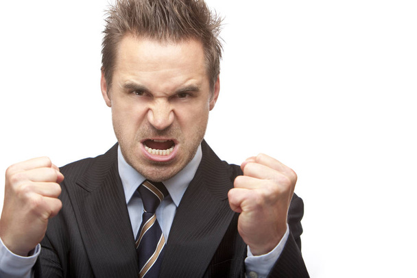 Businessman is quite angry and shows fists - 写真・画像