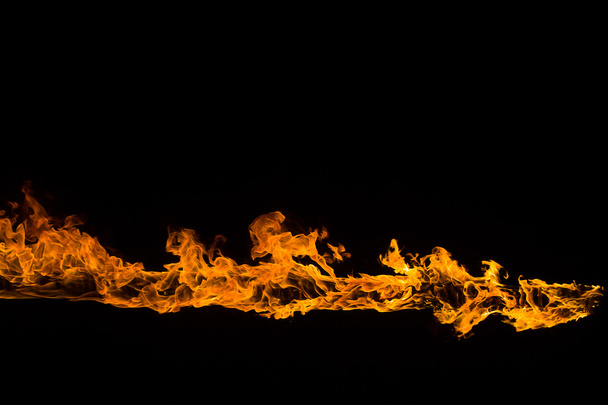 Blazing flames on black background - Foto, Imagen