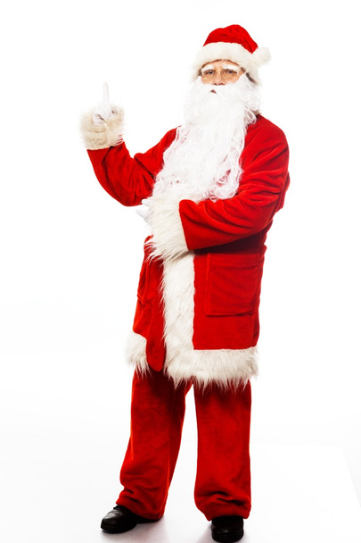 Santa Claus showing with gestures something isolated on white background - Foto, Imagen