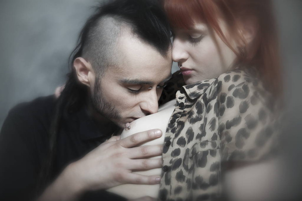 cute young caucasian couple urban style loving each other on isolated background - Foto, imagen