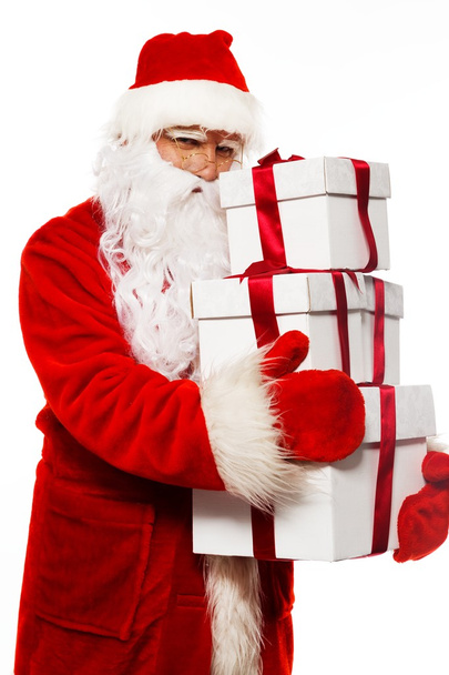 Santa Claus with gift boxes isolated on white background - Фото, изображение