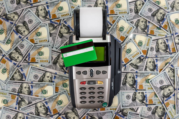 Dollar banknotes with terminal and credit card - 写真・画像