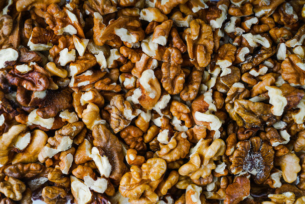 walnuts in bulk on the table. macro - 写真・画像
