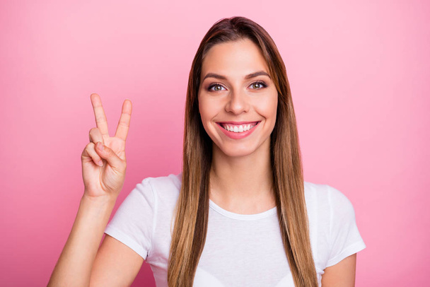 Close up photo of positive cheerful girl have spring time weekends make v-sign feel content emotions wear stylish outfit isolated over pink color background - Foto, immagini
