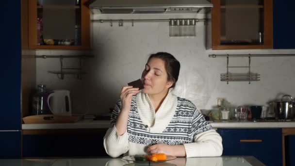 woman smells chocolate desiring to eat and changes mind - Footage, Video