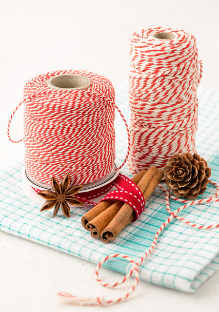 Cinnamon sticks, cones and kitchen string for christmas decor - Photo, image