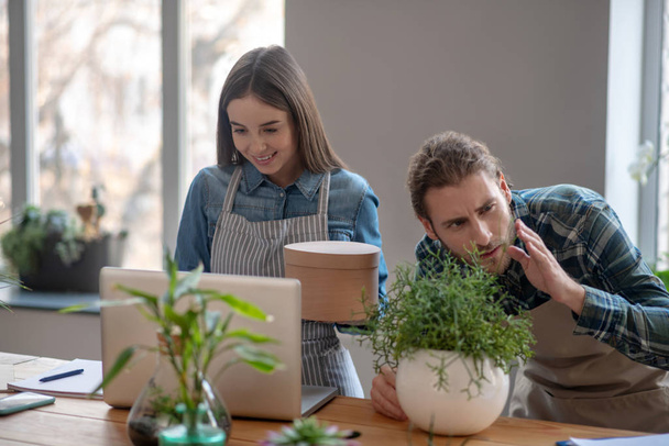 Man and a woman running an online plant store - Photo, image