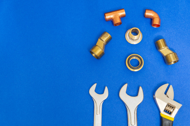 Set of tools for plumbing isolated on blue background with space for advertising - Fotó, kép