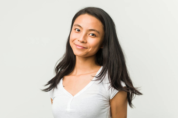 Young chinese woman posing on a white background - Photo, image