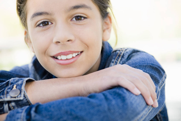 Portrait of Smiling Hispanic Teen Girl With Folded Arms - Photo, Image