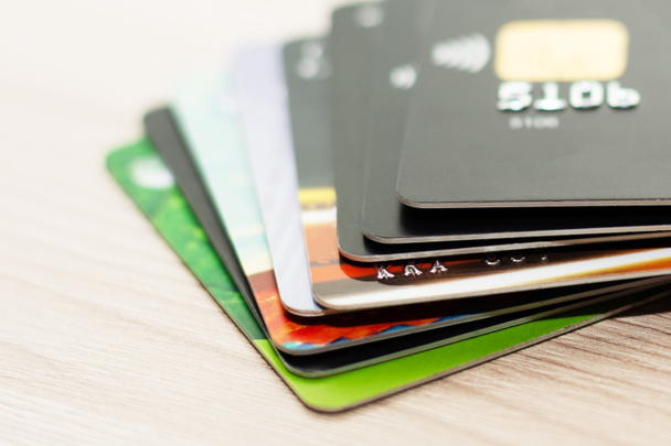 Many credit cards in different colors. Different credit cards. Contactless payment. - 写真・画像