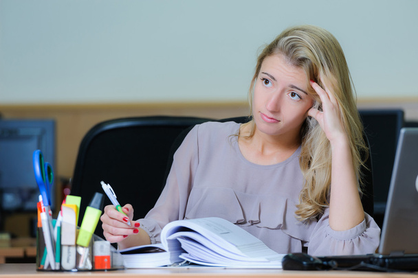 Tired businesswoman at the office - 写真・画像