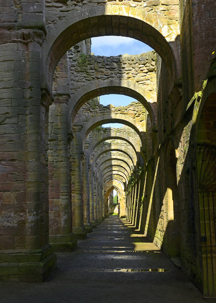 The ruins of the Fountains Abbey, Studley Royal, North Yorkshire, Ripon, England - UNESCO World Heritage site - Photo, Image