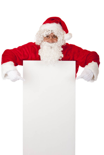 Santa Claus points with fingers on special Christmas advertismen - Fotó, kép