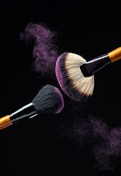 Makeup concept with a  professional makeup brushes with glowing  - Photo, Image