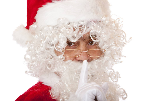 Old happy Santa Claus puts finger on lips to force silence - Фото, зображення