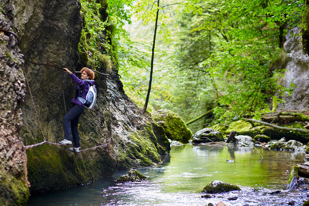 Woman climbing on a mountain wall - Fotografie, Obrázek