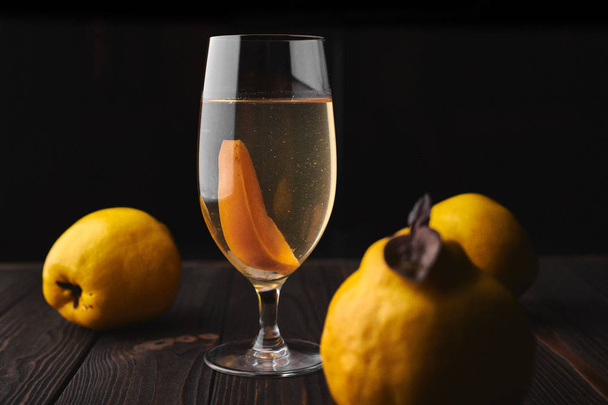 Natural compote, juice from a quince on a dark background - Foto, Imagen