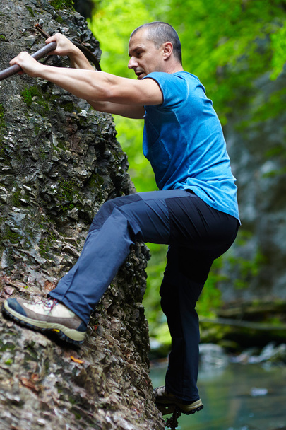 Man climbing mountain wall - Φωτογραφία, εικόνα