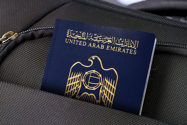 Close up of United Arab Emirates Passport in Black Suitcase Pocket  - Photo, Image