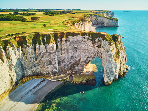 Picturesque panoramic landscape of white chalk cliffs and natural arches of Etretat, Normandy, France - 写真・画像